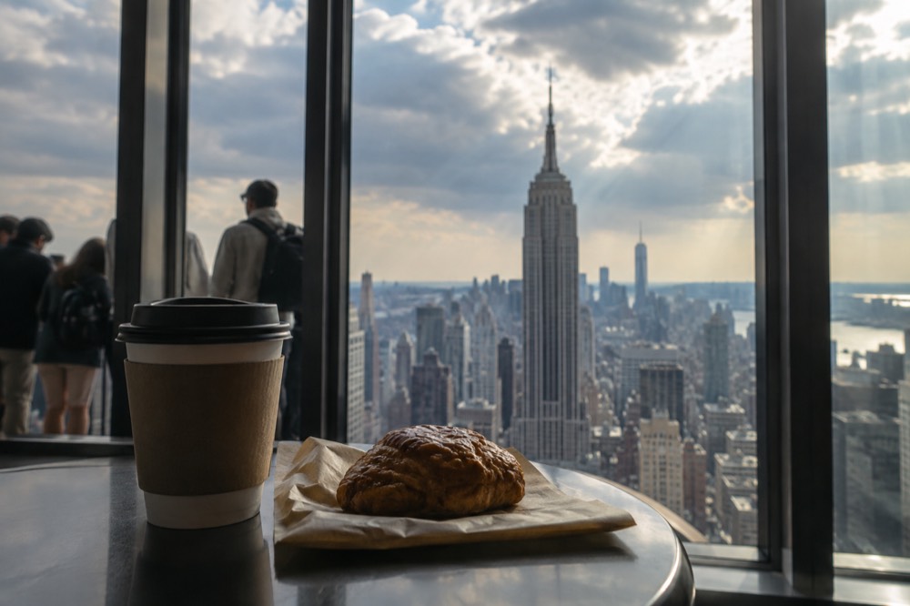 Coffee and pastry bought at an observatory café counter inside a landmark building