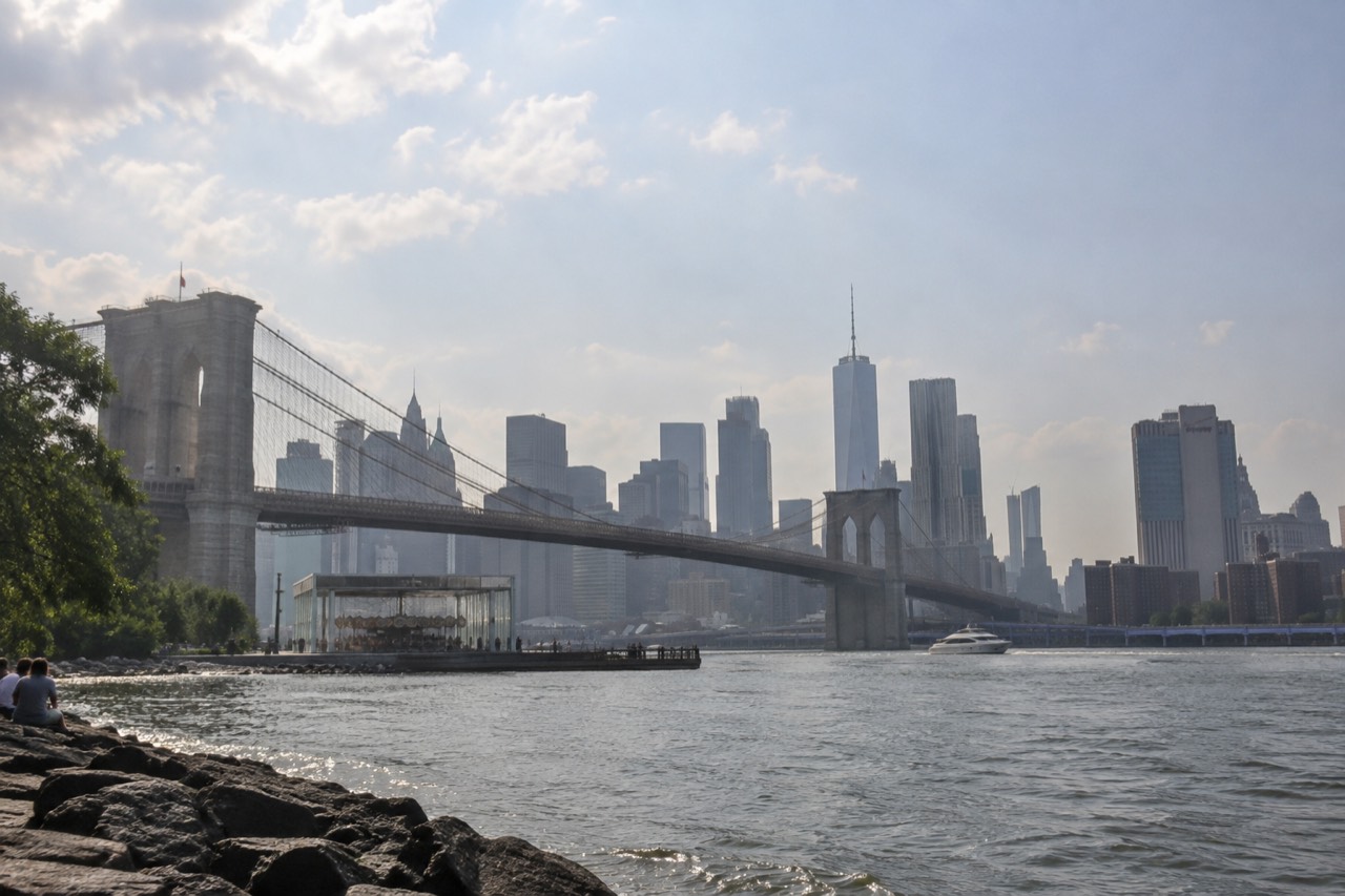Manhattan skyline on a humid summer afternoon with haze over the East River bridges