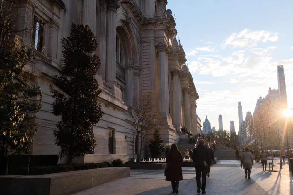 The Fifth Avenue facade of the Metropolitan Museum of Art stretching along the sidewalk toward its grand front steps