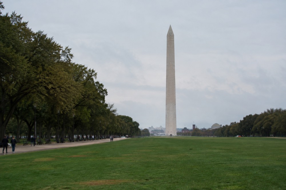The National Mall in Washington DC with the Washington Monument rising over a green lawn