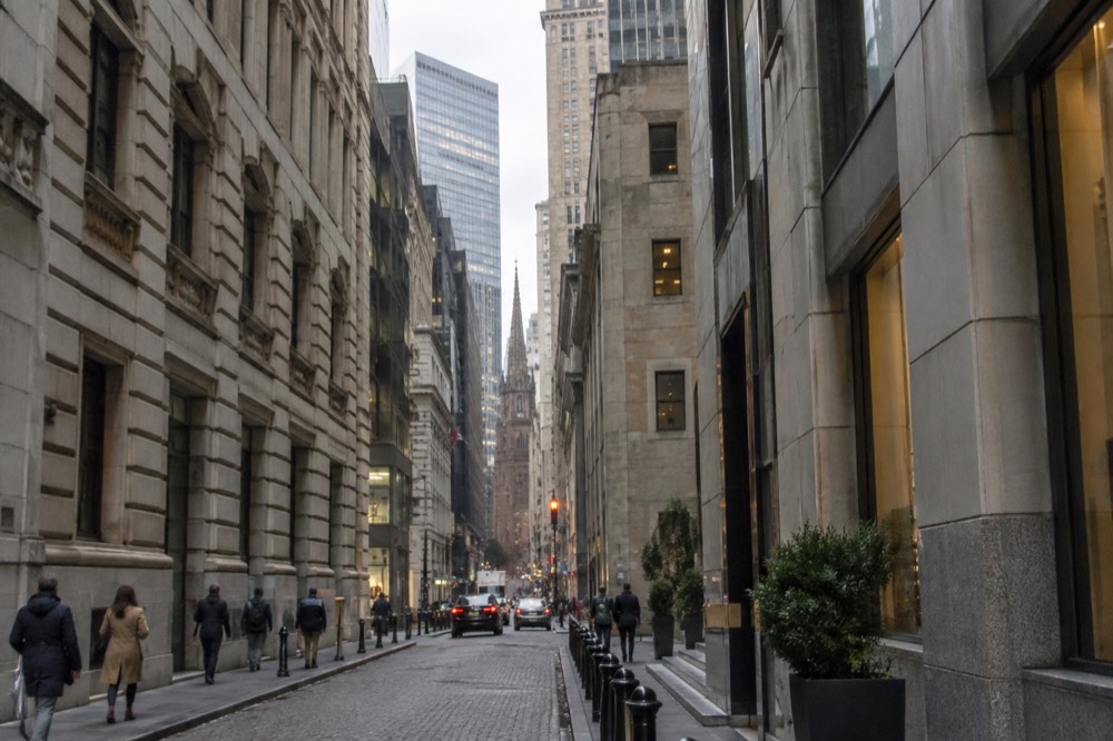 The narrow colonial-era lanes of the Financial District with modern towers rising above them