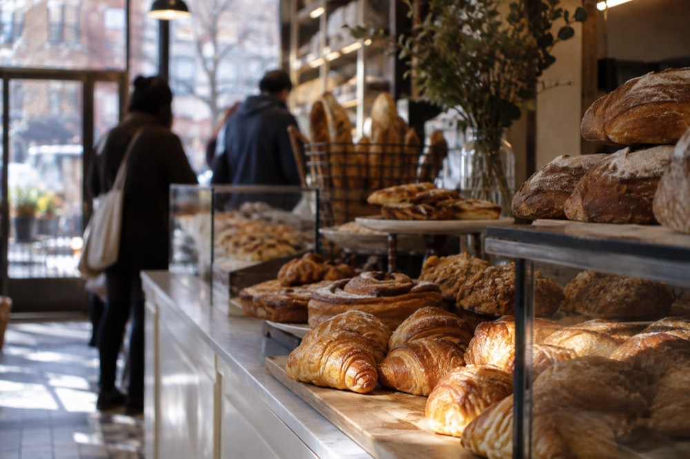 Bakery counter with pastries and breads in an Astoria, Queens shop