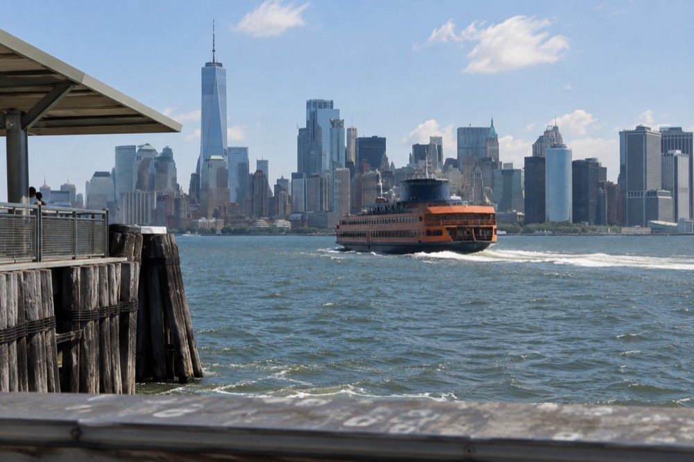The Staten Island Ferry crossing the harbor with the Lower Manhattan skyline behind it