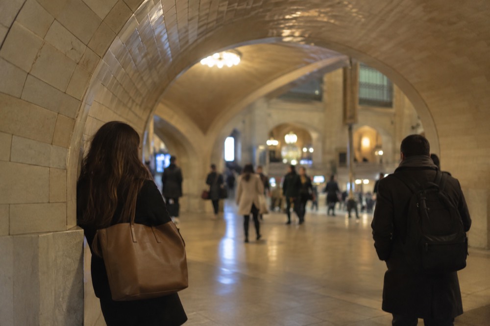 People standing in the tiled archway of the whispering gallery near the Oyster Bar