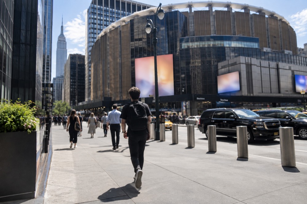 The exterior of Madison Square Garden above Penn Station in Midtown Manhattan on a busy afternoon