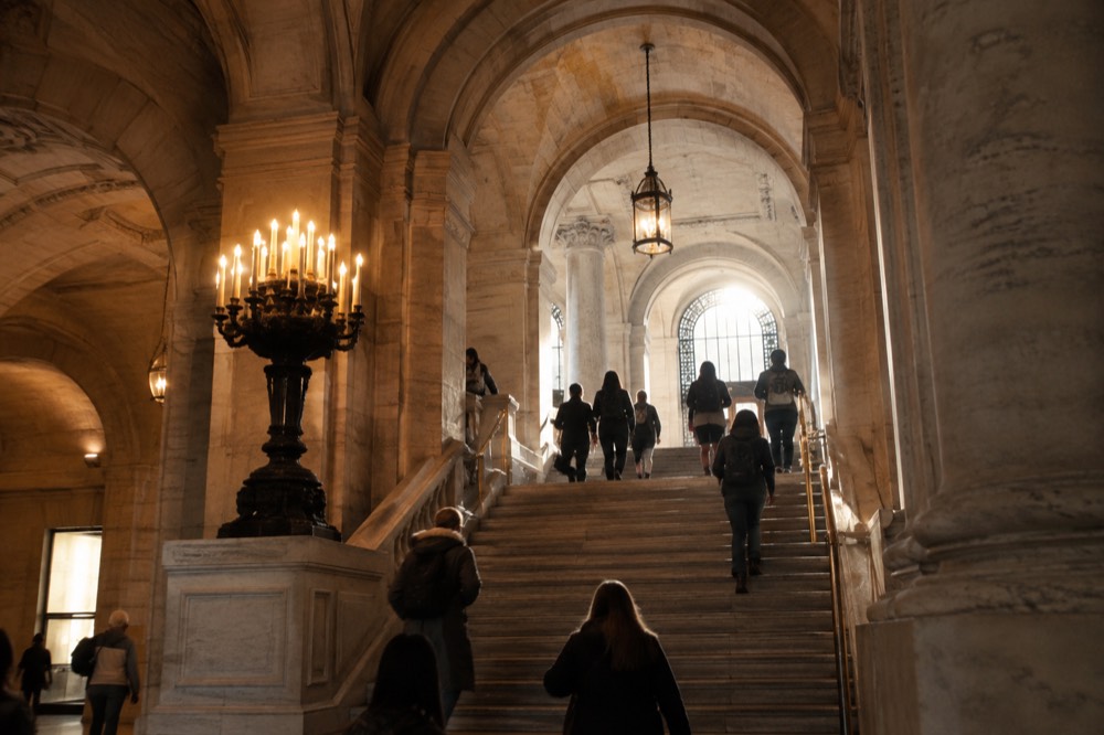 The high arched ceilings and marble staircases inside the entrance hall of the New York Public Library