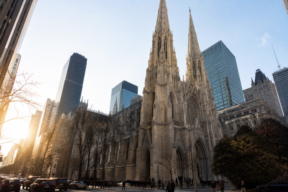 The gothic facade and spires of St Patrick's Cathedral seen from Fifth Avenue in Midtown Manhattan