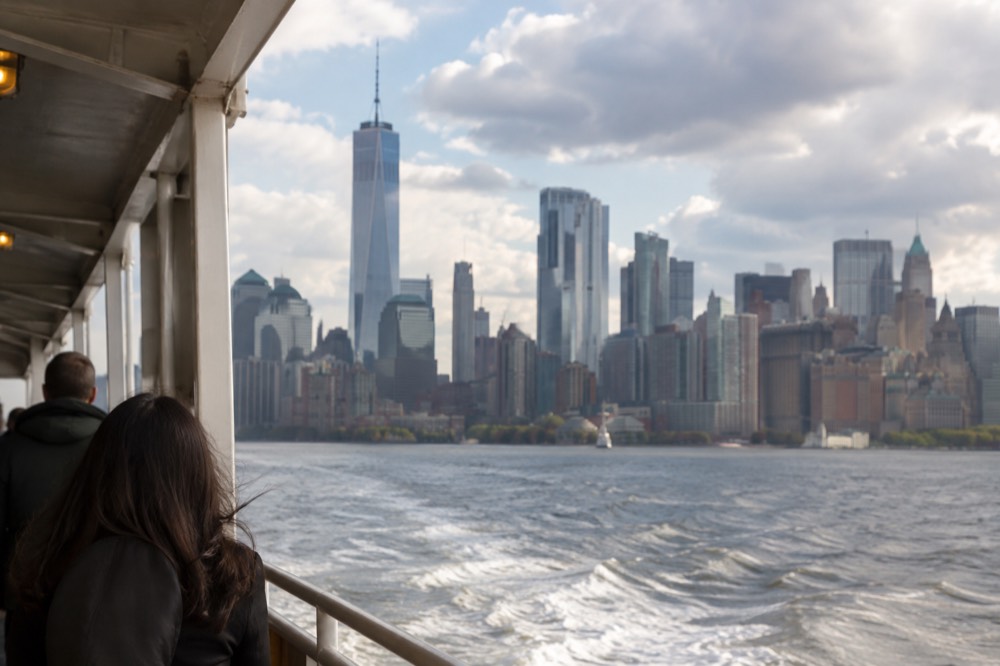 The Manhattan skyline seen across New York Harbor from the deck of a returning ferry