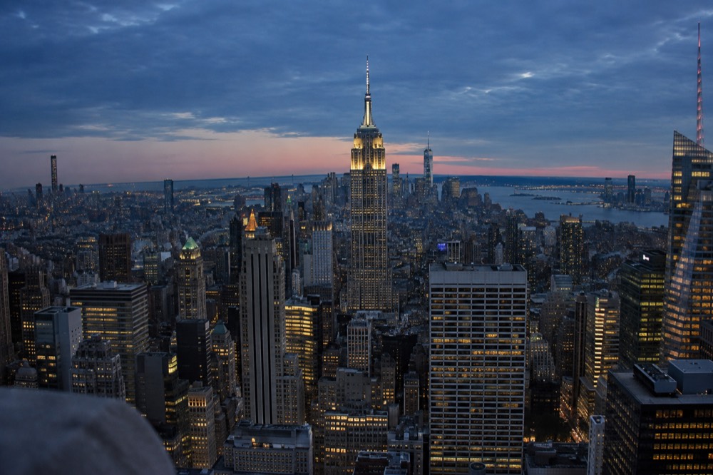 The view from Top of the Rock with the Empire State Building centered above the Midtown rooftops