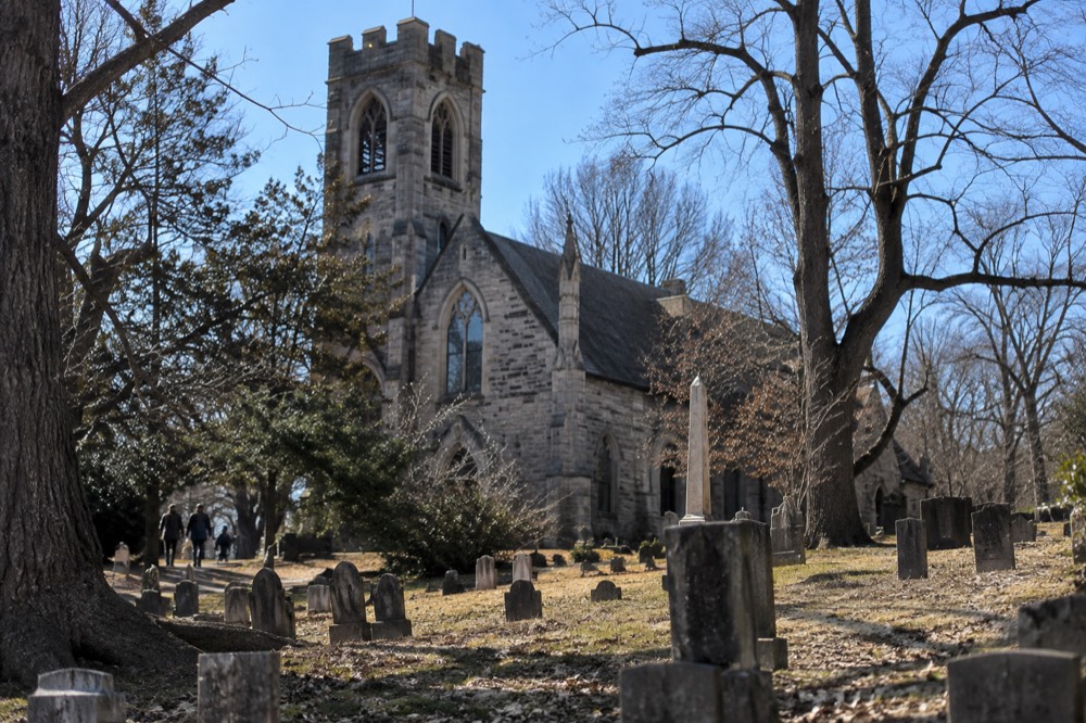 Gothic stone church surrounded by bare trees in Sleepy Hollow cemetery
