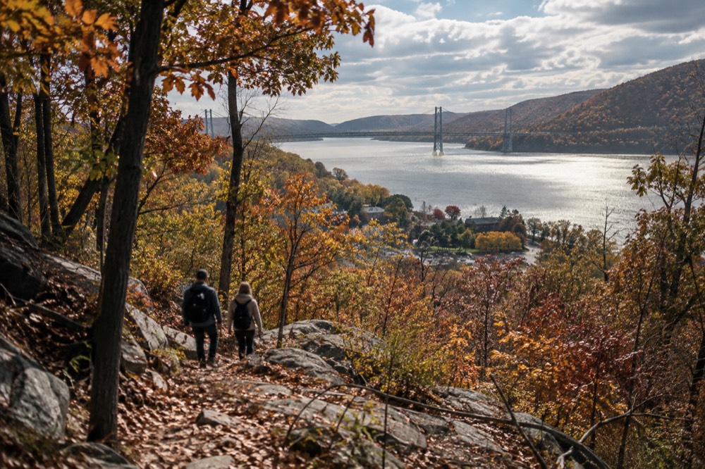 Wooded hillside above the Hudson River in full fall color