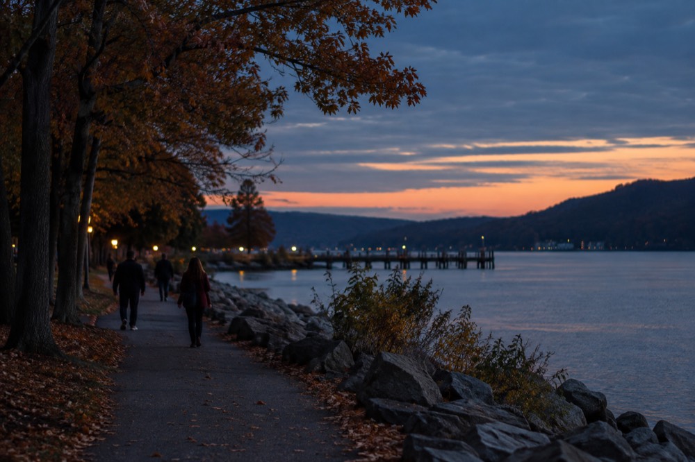Fall foliage lining a path beside the Hudson River