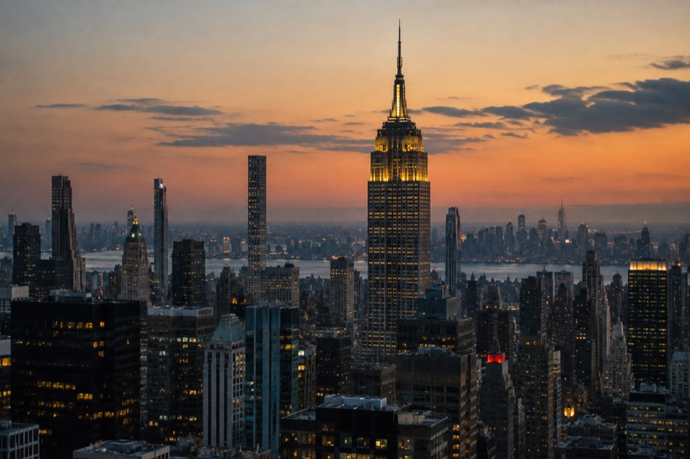 The Empire State Building rising above the Midtown Manhattan skyline at dusk