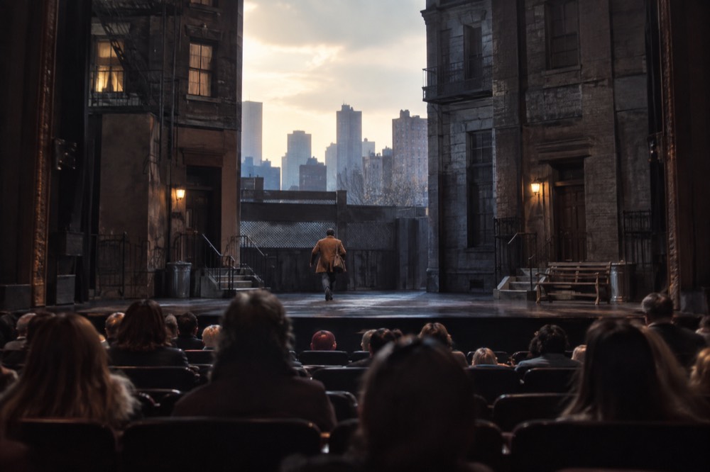 A view of a Broadway stage from mid-orchestra seats with the curtain open