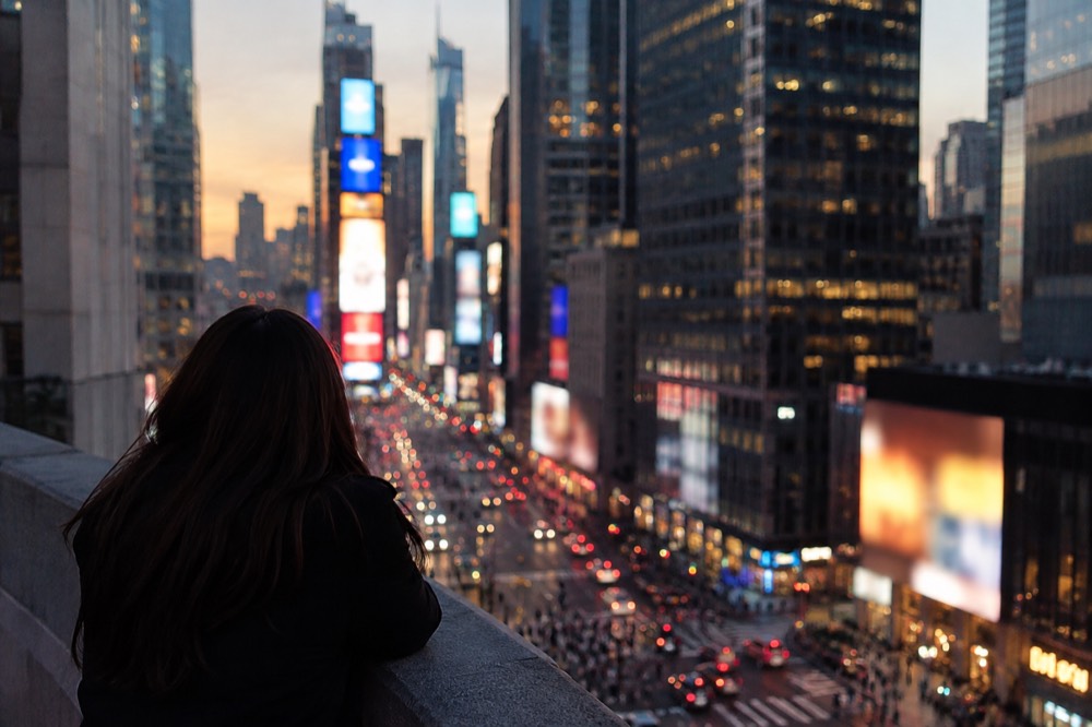 Evening lights of Times Square seen from above at dusk