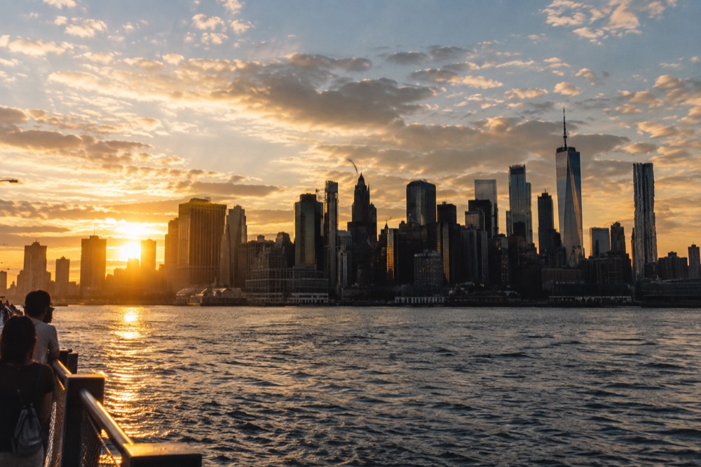 The Manhattan skyline at golden hour seen from across the water