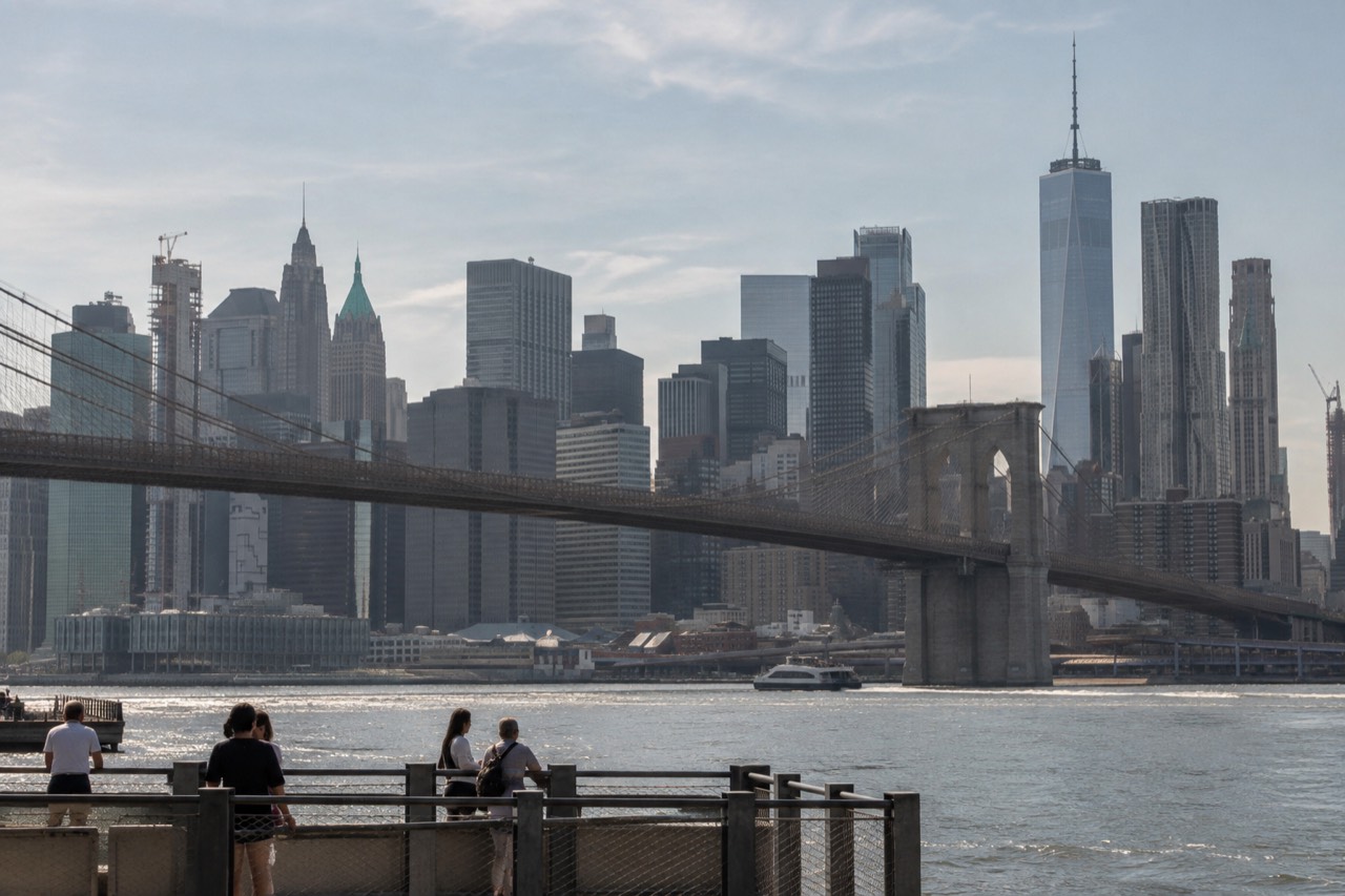 Sunlight over the Manhattan skyline and East River on a hot summer afternoon