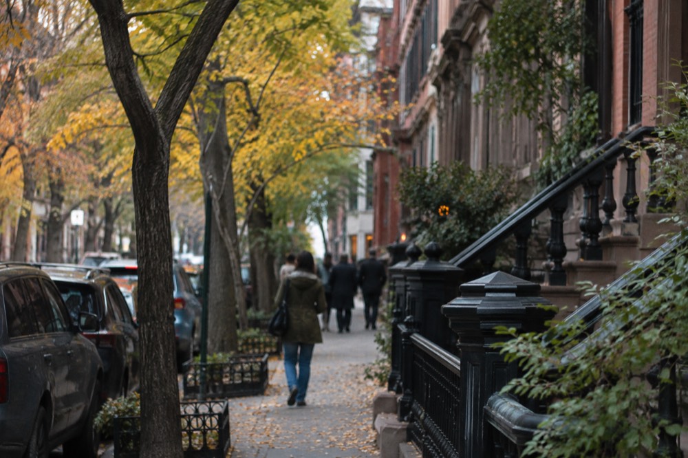 A street in Greenwich Village lined with trees in autumn color
