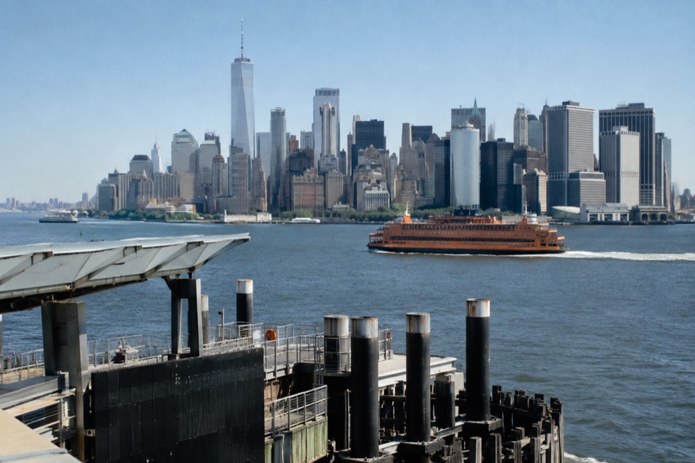 The Staten Island Ferry passing in front of the Lower Manhattan skyline on a clear day
