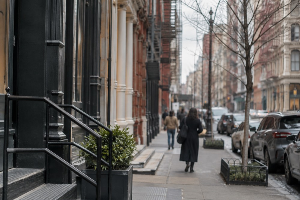 A quiet SoHo street with cast-iron buildings and afternoon light