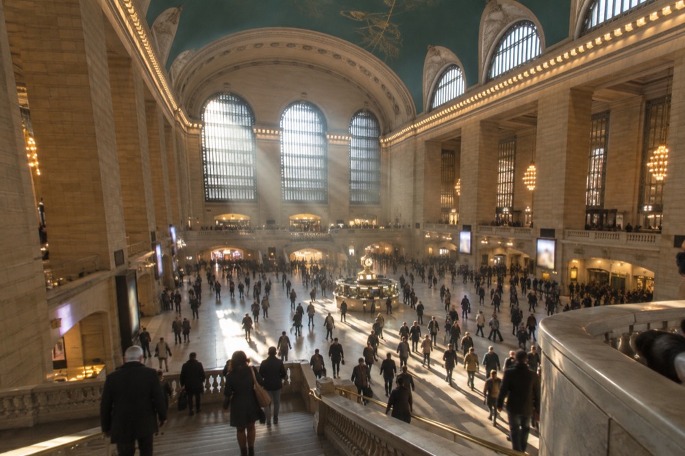 The main concourse of Grand Central Terminal with the celestial ceiling and afternoon light through the arched windows