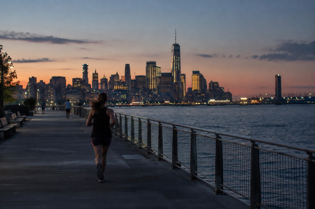 Manhattan skyline seen across the water at golden hour